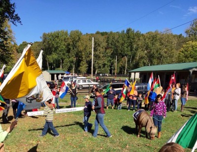 Lucky Orphans Carrying Peace Pole Oct 2015 WPFCjpg